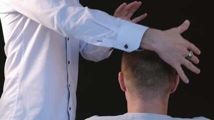 Biofield treatment and telepathy. A man diagnoses a patient using the biofield of his hands