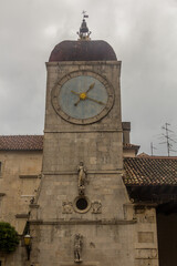 Fototapeta na wymiar Clock tower in the old town of Trogir, Croatia