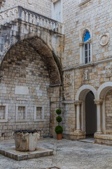 Fototapeta na wymiar Courtyard of the town hall in the old town of Trogir, Croatia
