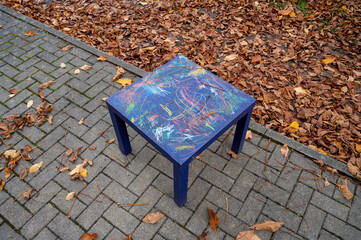 Colorful painted table on the sidewalk 