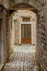 Fototapeta na wymiar Narrow alley in the old town of Trogir, Croatia