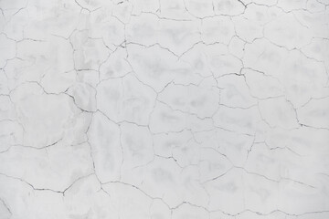 White plastered old cracked wall background texture