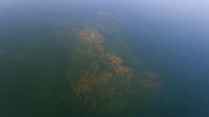 Fototapeta na wymiar The Lake Szelment in the Suwalki Region in autumn colors