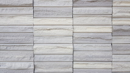 Fototapeta premium The walls are made of small granite pieces arranged in a row.