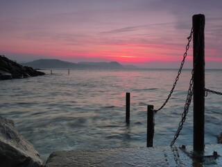 beautiful sunrise over the sea at Lyme Regis Dorset England	