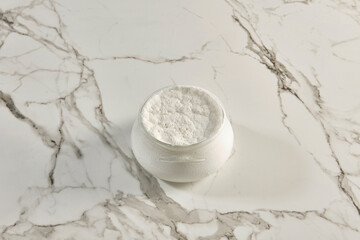 Natural yogurt on the marble table background, healthy lifestyle, dairy products.