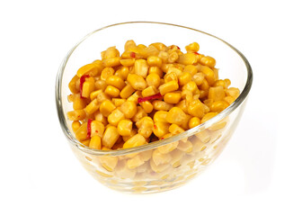 A bowl of sweet corn kernels with pieces of bell peppers and chilli peppers, on a white background
