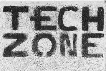  "Tech zone" writing on the asphalt 
