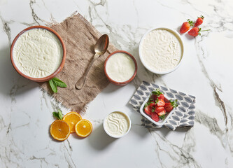 Group of yogurt natural healthy lifestyle, marble background.