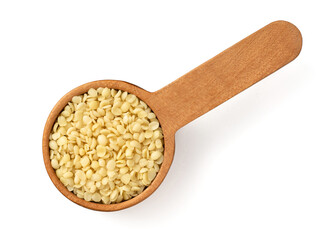 Hulled hemp seeds in the wooden spoon, isolated on white background, top view