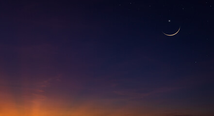 Obraz na płótnie Canvas crescent moon and clouds on dusk sky twilight