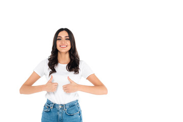 Fototapeta premium happy asian woman looking at camera and showing thumbs up isolated on white.