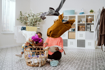 Funny girl disturbs mom doing laundry in bathroom, wants to spend time with woman, play, daughter...
