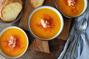 Thanksgiving concept with pumpkin soup .Fall table setting for celebration Autumn holiday with soup.
