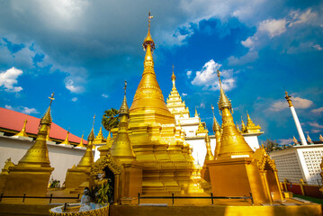 Naklejka premium Wat Thai Wattanaram It is a Thai temple that is built in Myanmar style. There is a beautiful golden color in Mae Sot District, Tak Province, Thailand.