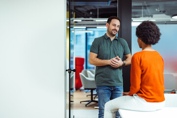 Experienced company executive, sharing his knowledge with his new coworker.