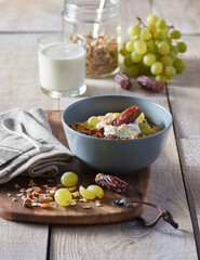 Fresh granola, muesli with yogurt and berries on marble background. Healthy breakfast. Copy space. Top view.