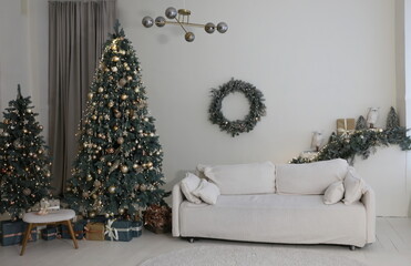 elegant Christmas tree with gifts in the living room with textured gray walls in luxury apartments