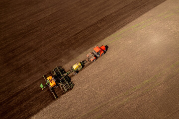 Arable agriculture concept, Aerial top view rural. Farmer on tractor cultivation and plows land of...