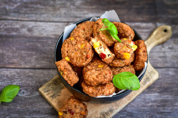 Home made  oven baked meatballs  from  chicken and vegetables and french potato  fries on  wooden background.Bifteki, or spicy meatballs 