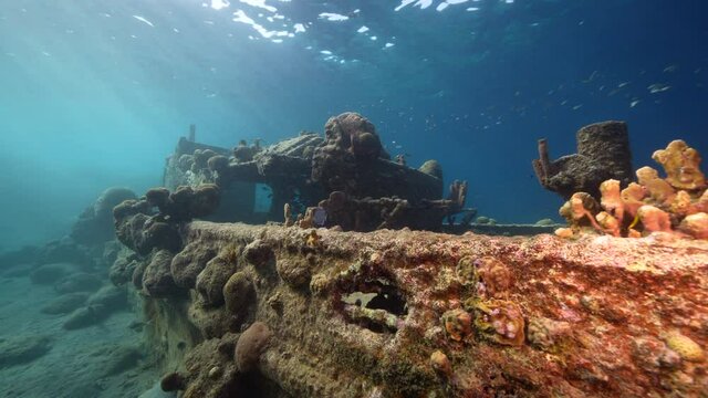 Seascape with Tugboat Wreck in the coral reef of Caribbean Sea, Curacao