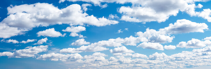 Naklejka na ściany i meble Blue sky with soft white clouds in sunny day