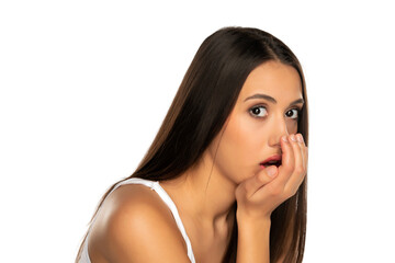 Fototapeta premium a young woman checks her breath with her palm