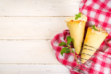 Trendy Cone pizza, modern pizza recipe, with tomatoes, basil, mozzarella cheese, baked pizza cones...
