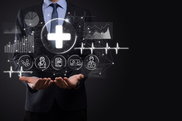 Businessman hold virtual plus medical network connection icons. Covid-19 pandemic develop people awareness and spread attention on their healthcare.Doctor,document,medicine,ambulance,patient icon.
