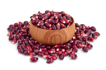 Purple corn seeds in wooden bowl isolated on white background with clipping path and full depth of field