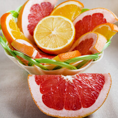 The basket contains slices of citrus fruits - lemon, grapefruit, orange. Citrus fruits are rich in vitamins