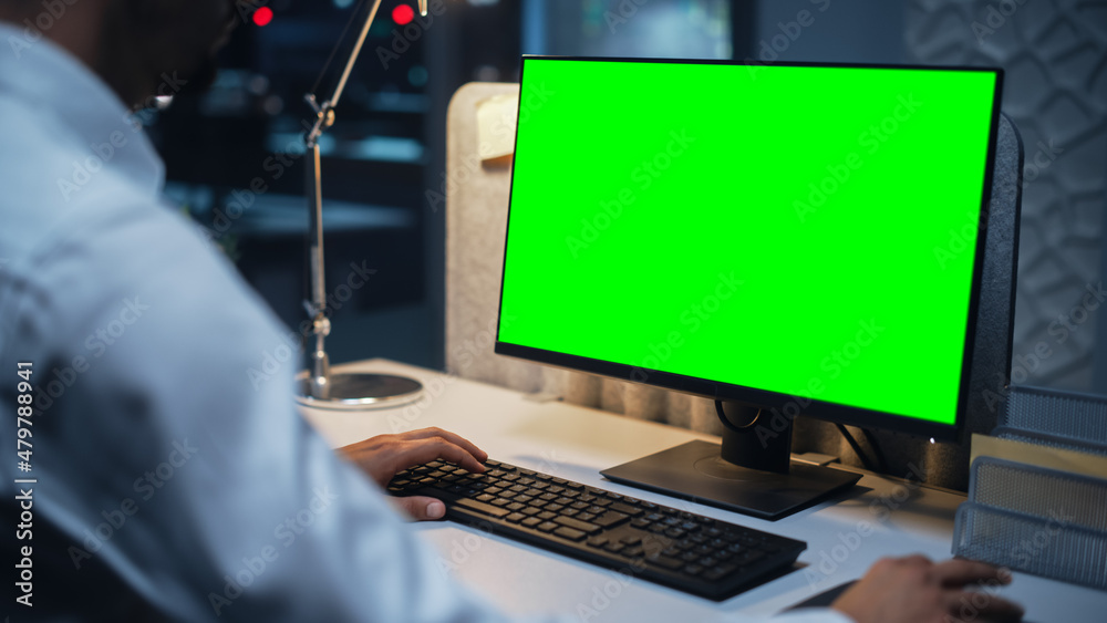 Aufkleber Close Up of a Businessman Working on Desktop Computer with Chroma Key Green Screen Mock Up Display. Male Executive Director Managing Digital Projects, Typing Data, Using Keyboard and Mouse.
