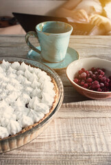 Vintage toned berry meringue tart.