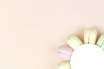 Colorful marshmallow french macarons background, close up. Top view. Free space for text.
