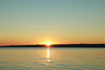 Fototapeta premium Picturesque view of beautiful sunset over calm river