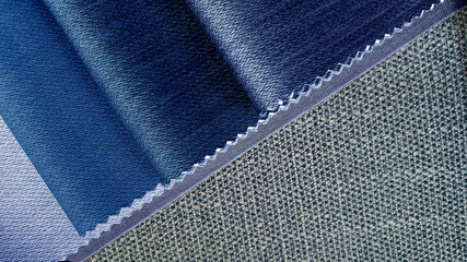 close up blue tone fabric samples in catalog book matching with grey textile linen drapery fabric....