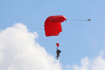 Skydiver in a blue sky	