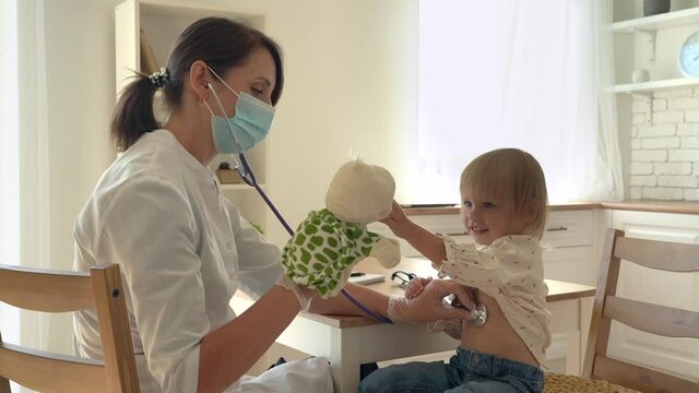 Cute little girl at the hospital at the doctor's appointment. 
