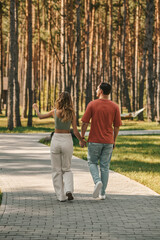 Fototapeta premium Young couple spending time together in the park