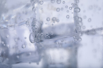 Naklejka na ściany i meble Closeup view of soda water with ice