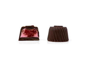 Chocolate candies with apple filling isolated on white background.