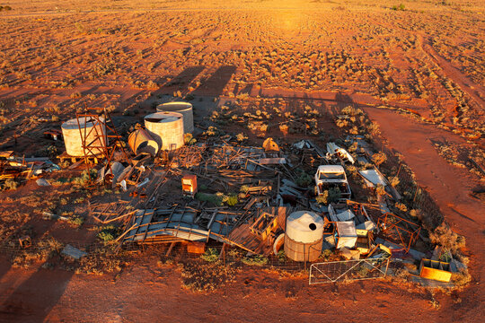 Aerial view of a outback scrap yard in a red desert landscape