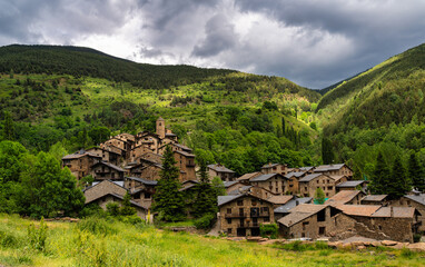 view of the rural village Os de Civís in the Catalan Pyrenees with the stone houses. - obrazy, fototapety, plakaty