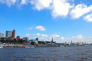 Fototapeta na wymiar Panoramic view of Hamburg city with the Elbe river, Germany, Europe. Beautiful view of crowded Hamburg waterfront, tourist boats and ships.