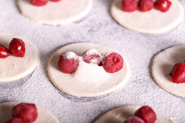 dumplings with frozen cherries are prepared in the kitchen