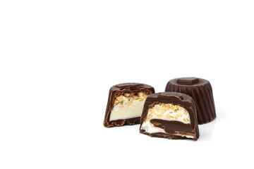 Chocolate candies with nougat and nuts isolated on white background.