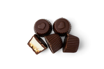 Chocolate candies with nougat and nuts isolated on white background.