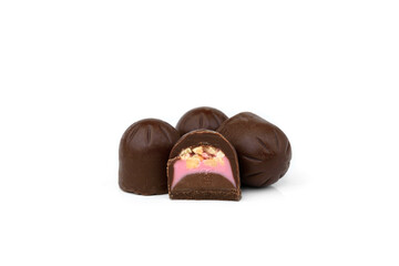 Chocolate candies with nougat and nuts isolated on white background.