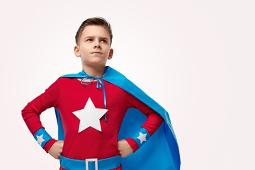 Brave superhero kid looking up in studio © kegfire
