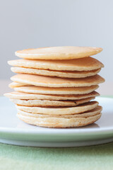 Pile of pancakes illuminated with natural light